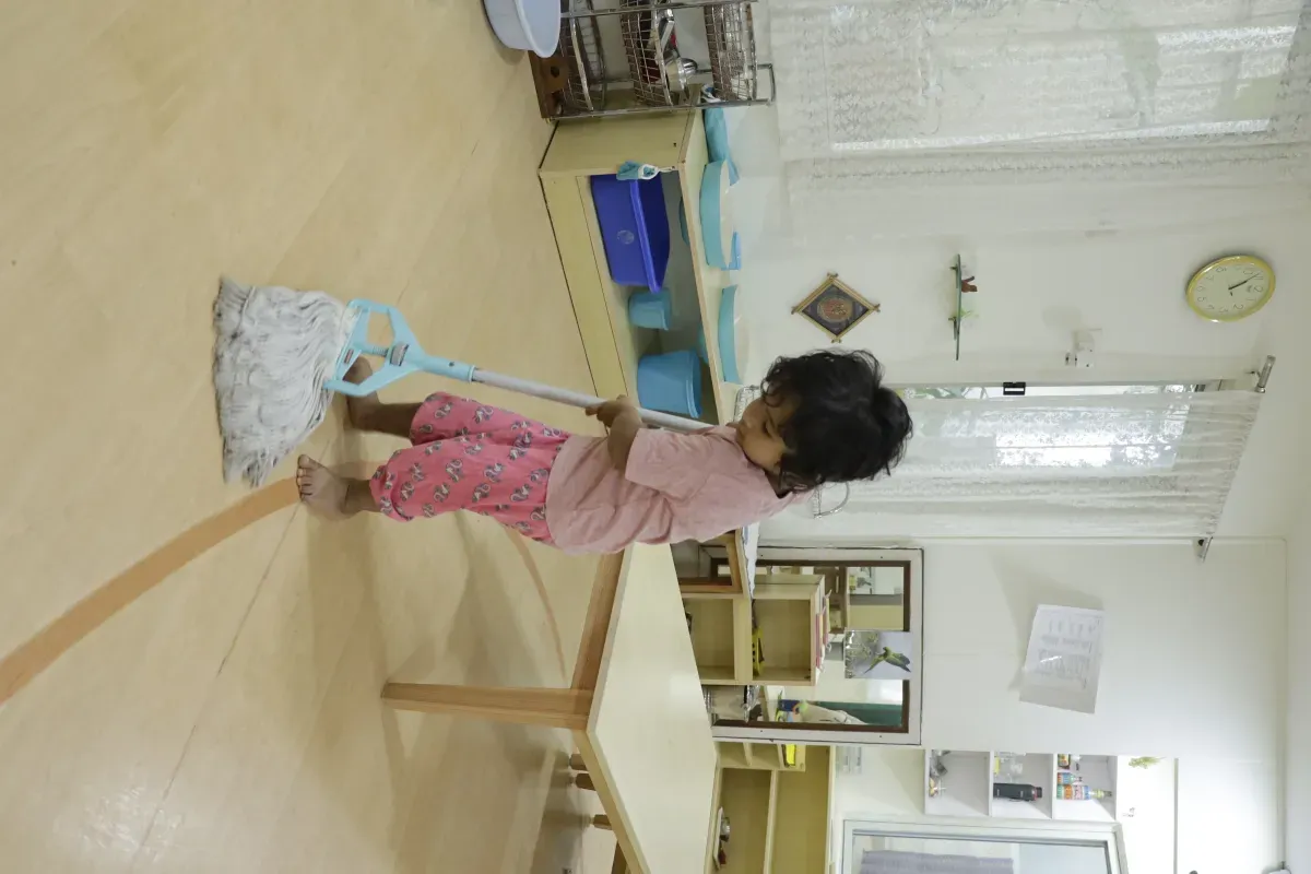 Toddler mopping