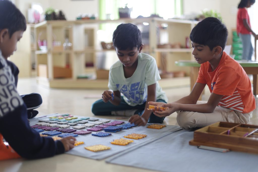 Child-led learning Montessori in practice — children working independently with hands-on material at Blue Blocks Montessori School in Hyderabad.