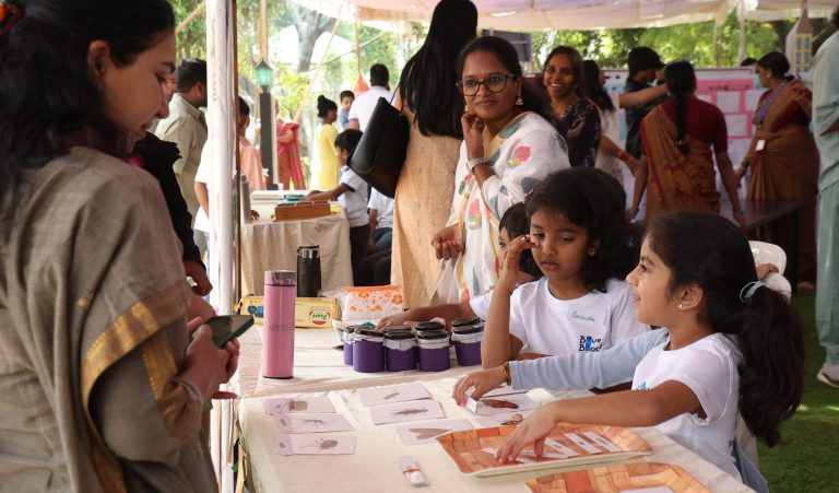 Self-expression in Montessori in practice — a young child explaining a project to visitors at Blue Blocks Montessori School in Hyderabad.